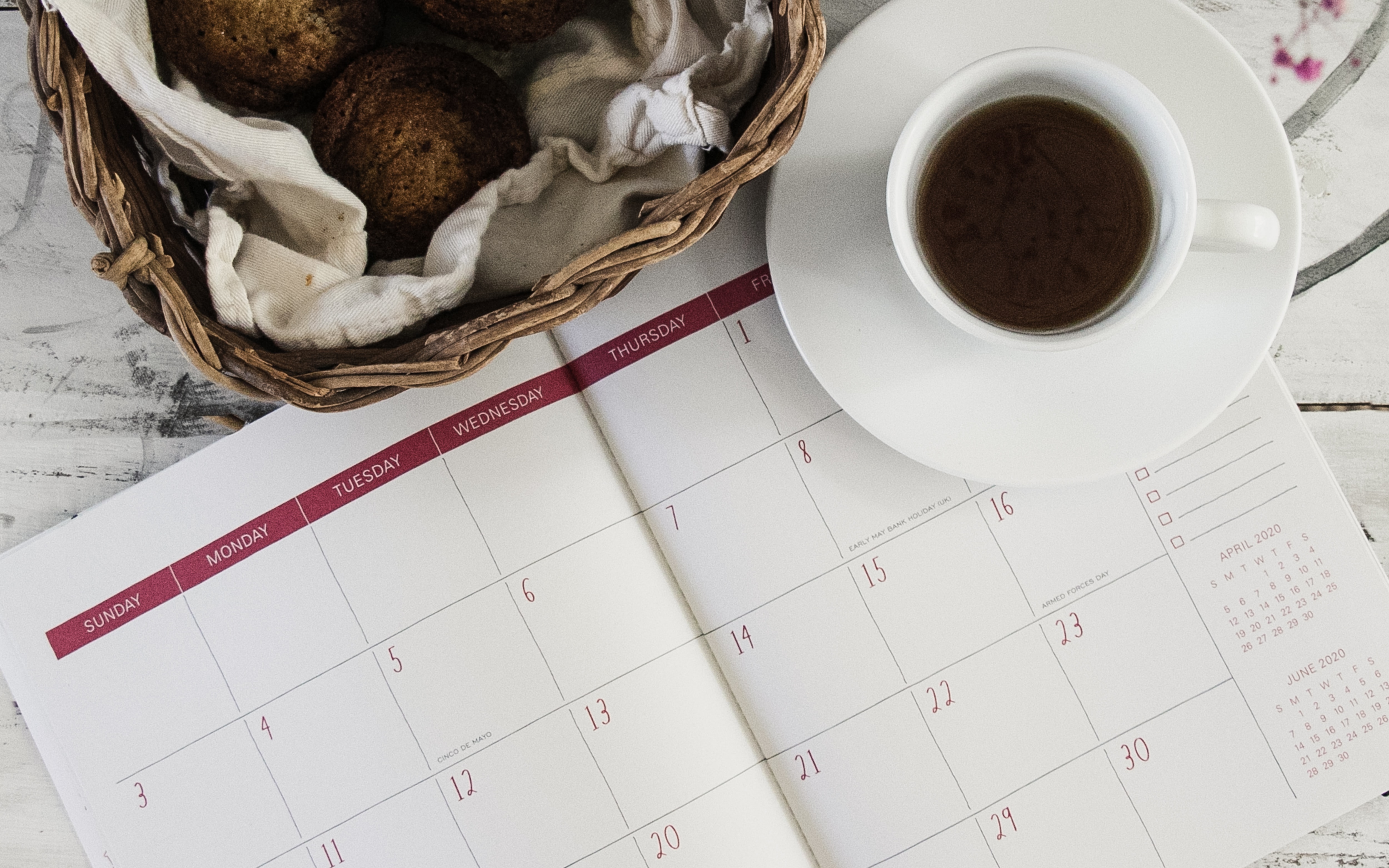 Picture of a coffee cup and a calendar.